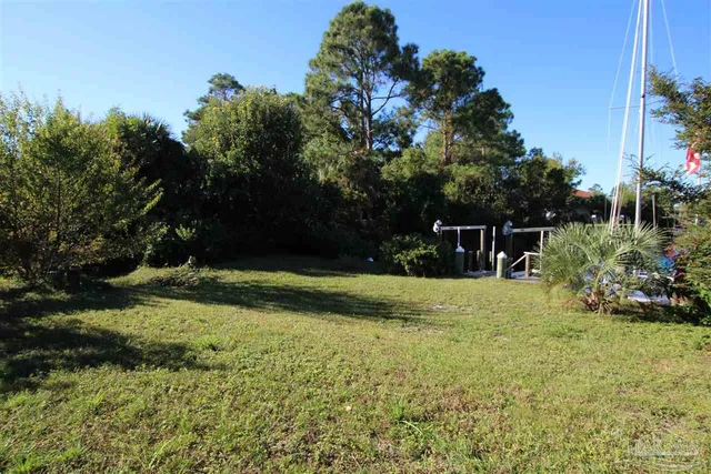 a view of a garden with lawn chairs