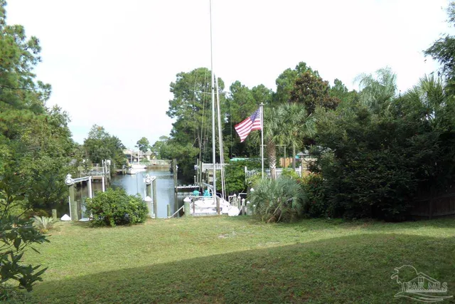 a childrens park with lots of green space and trees