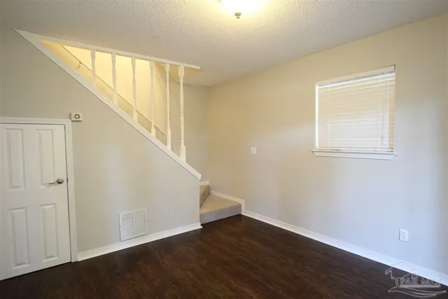 a view of an entryway with wooden floor