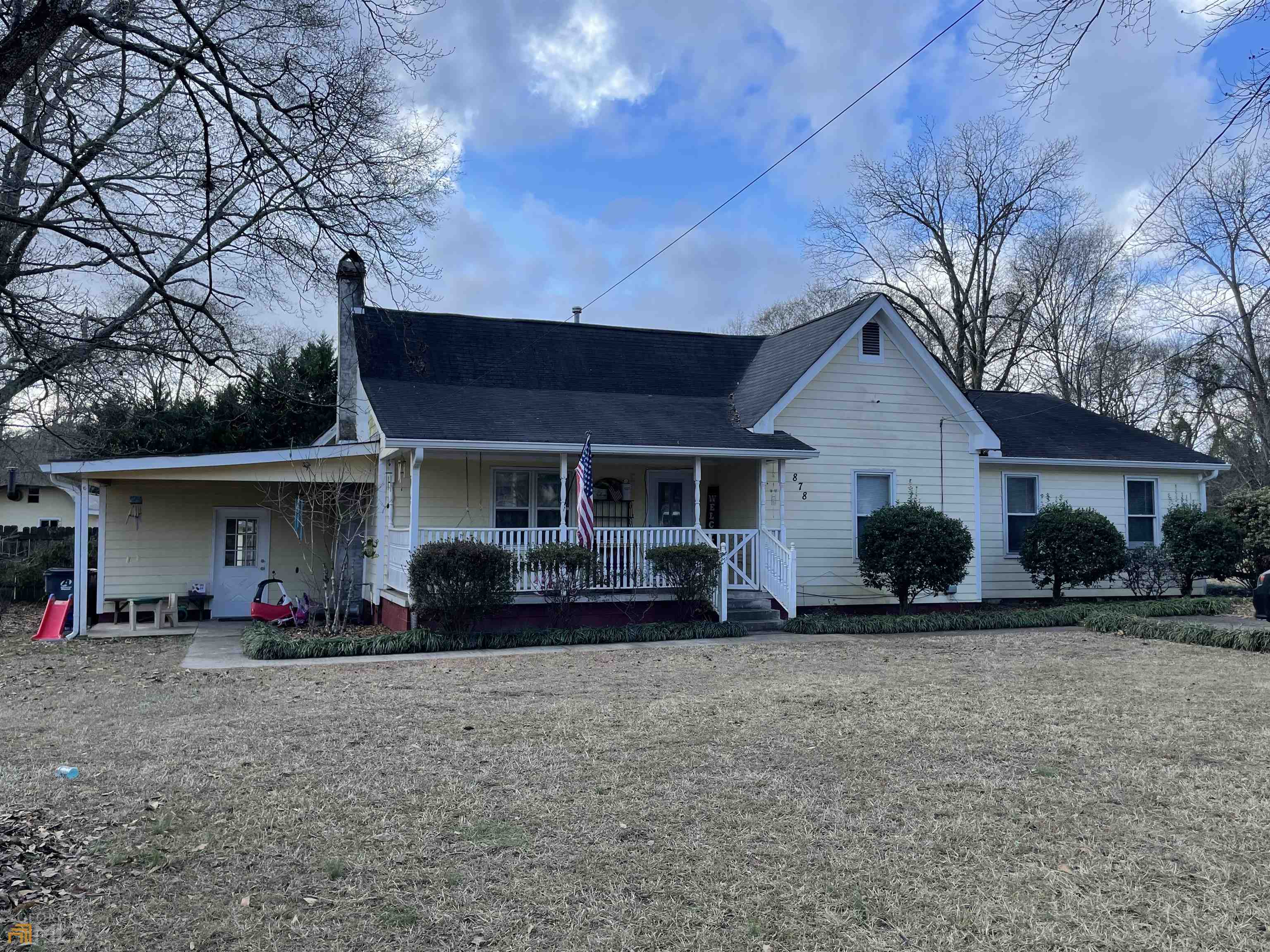 a front view of a house with a yard