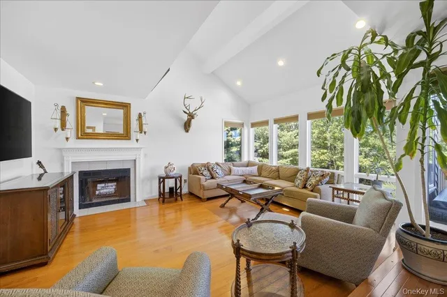 a view of a livingroom with furniture and a wooden floor