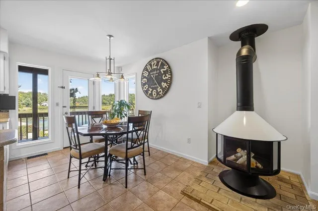 a dining room with furniture and window