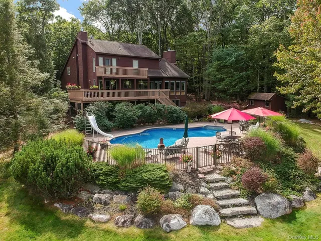 a view of a chair and table under an umbrella
