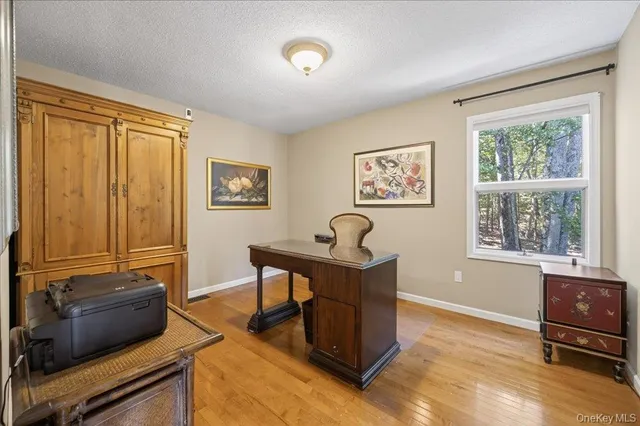 a bed room with a bed and a ceiling fan