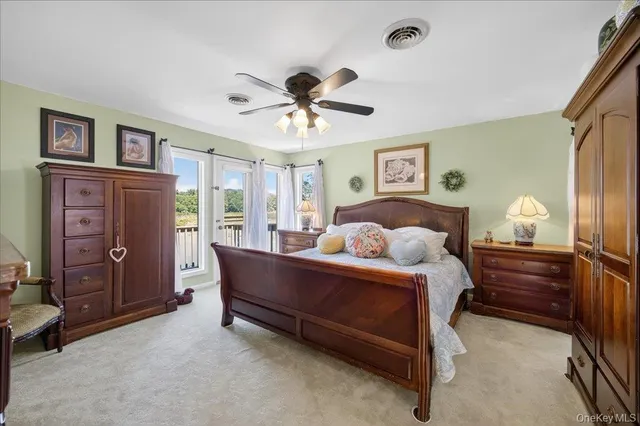 a bedroom with a bed and a wooden floor