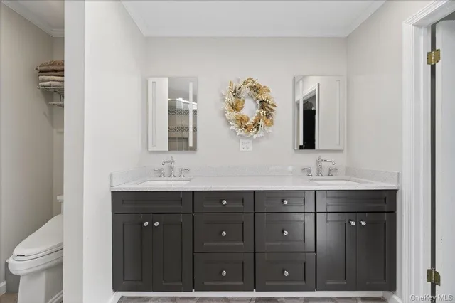 a spacious bathroom with a granite countertop sink toilet and shower