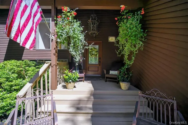 a view of house with potted plants
