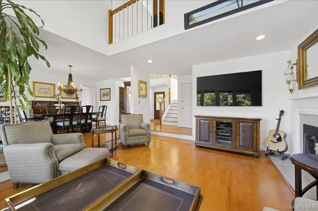 a living room with fireplace furniture and a flat screen tv