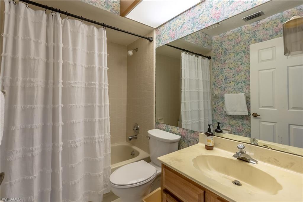 2048 Pine Isle Lane, Unit 2048 Naples, FL 34112 - Photo 17 of 50 a bathroom with a sink toilet and shower