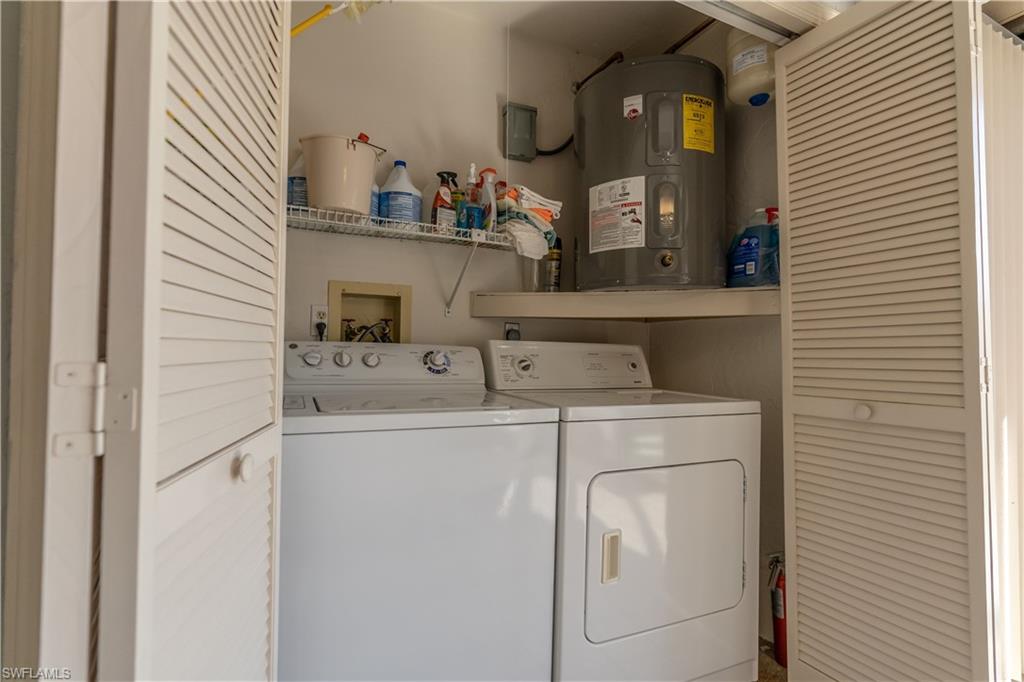 2048 Pine Isle Lane, Unit 2048 Naples, FL 34112 - Photo 21 of 50 a utility room with dryer and washer