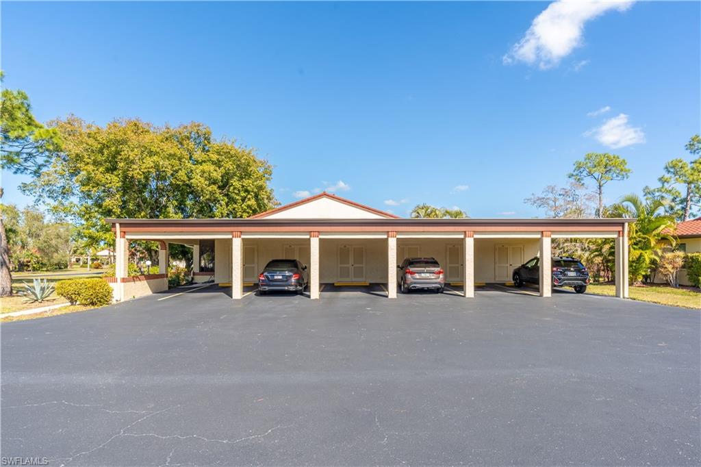 2048 Pine Isle Lane, Unit 2048 Naples, FL 34112 - Photo 31 of 50 a view of a house with a patio