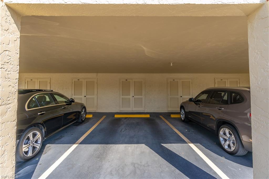 2048 Pine Isle Lane, Unit 2048 Naples, FL 34112 - Photo 33 of 50 a car parked in front of a house