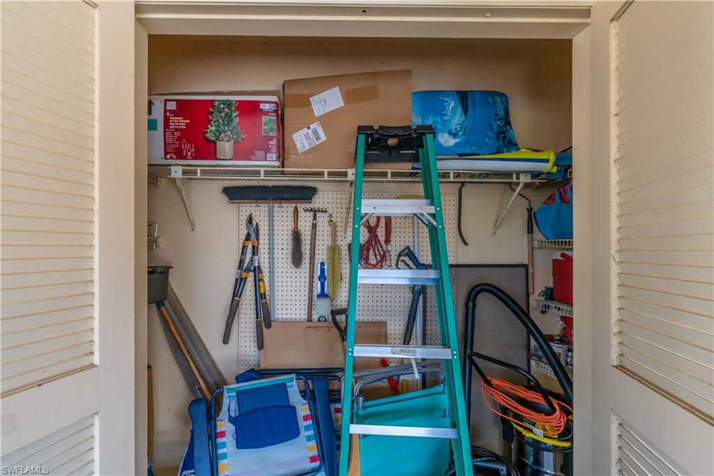 2048 Pine Isle Lane, Unit 2048 Naples, FL 34112 - Photo 34 of 50 a utility room with dryer and washer