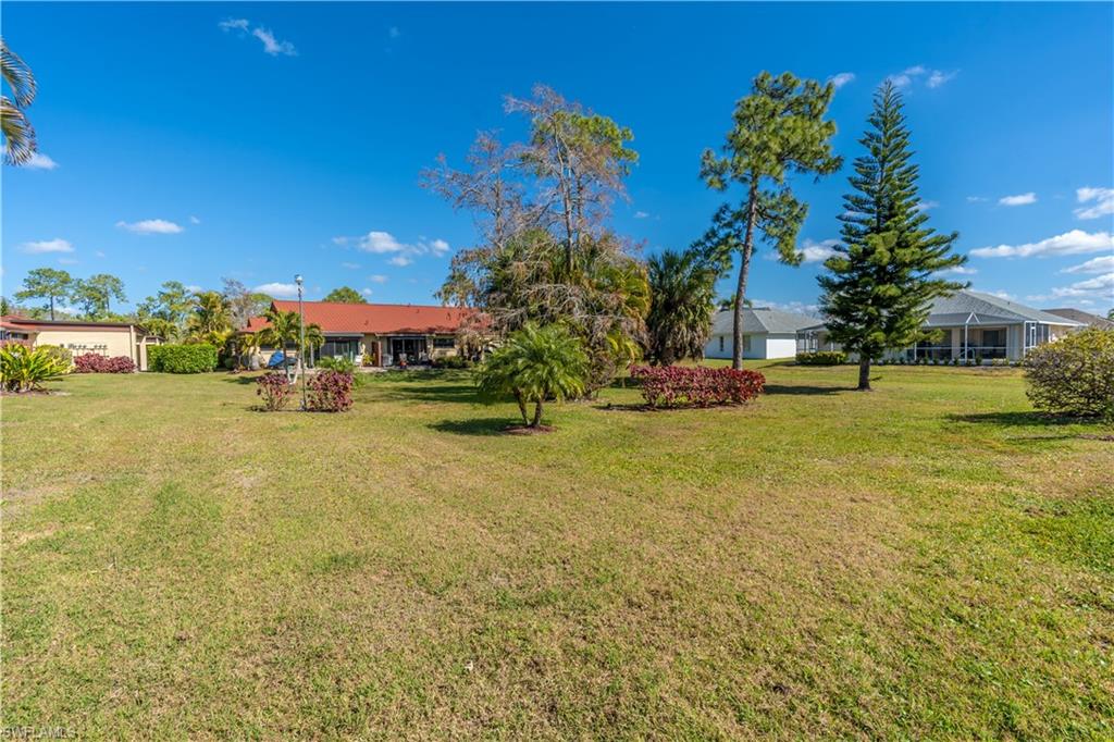 2048 Pine Isle Lane, Unit 2048 Naples, FL 34112 - Photo 37 of 50 a view of a street with houses