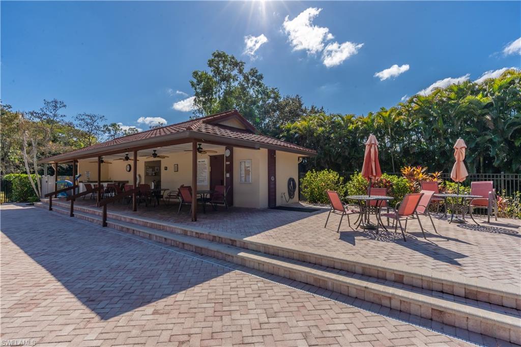 2048 Pine Isle Lane, Unit 2048 Naples, FL 34112 - Photo 42 of 50 a view of a house with a patio