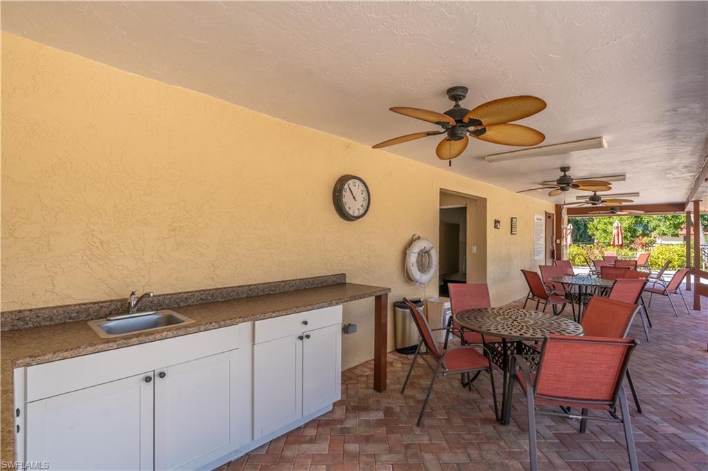 2048 Pine Isle Lane, Unit 2048 Naples, FL 34112 - Photo 46 of 50 a view of a livingroom with furniture and a ceiling fan