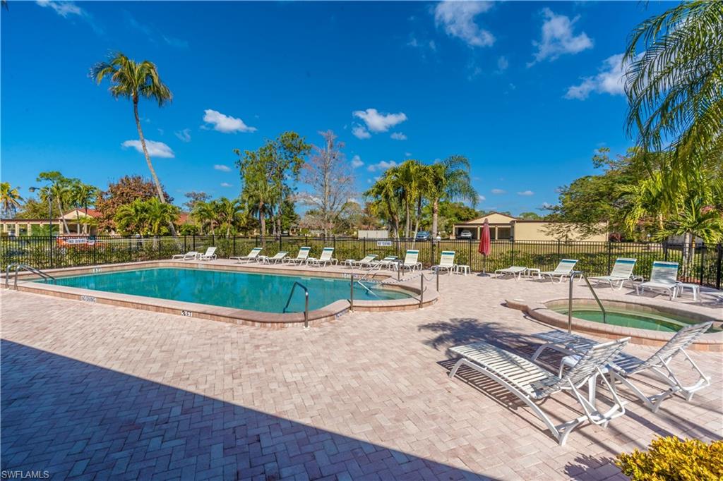 2048 Pine Isle Lane, Unit 2048 Naples, FL 34112 - Photo 47 of 50 a view of a swimming pool with a patio