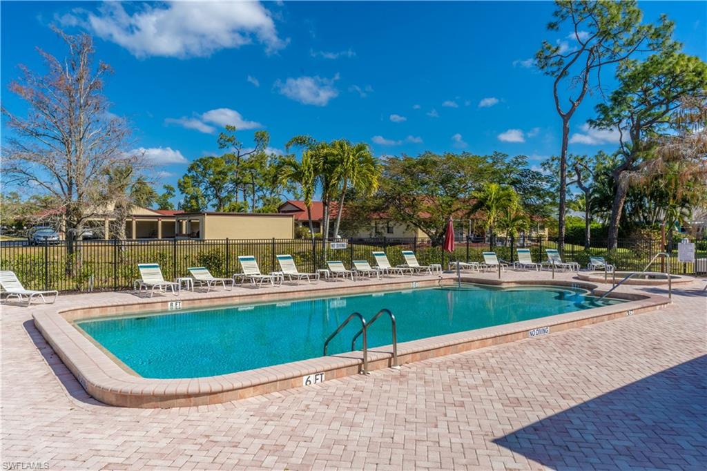 2048 Pine Isle Lane, Unit 2048 Naples, FL 34112 - Photo 49 of 50 a view of a swimming pool and outdoor space