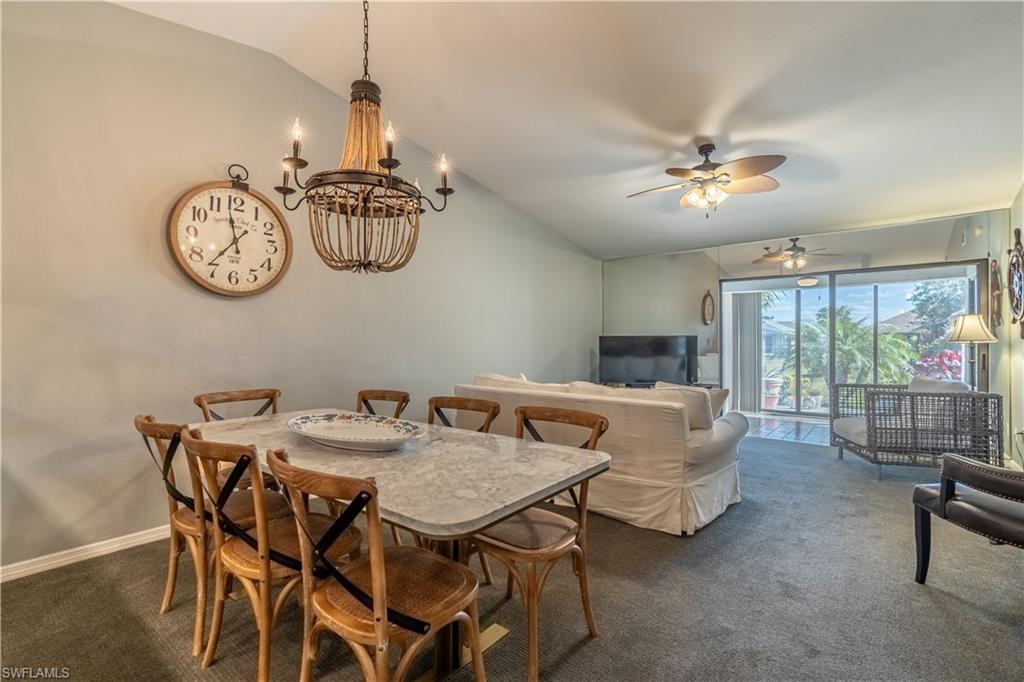 2048 Pine Isle Lane, Unit 2048 Naples, FL 34112 - Photo 6 of 50 a view of a dining room with furniture window and outside view