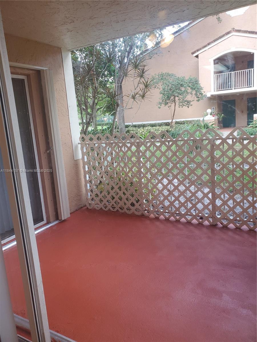 3874 Lyons Road, Unit 1126 Coconut Creek, FL 33073 - Photo 12 of 22 a view of a porch