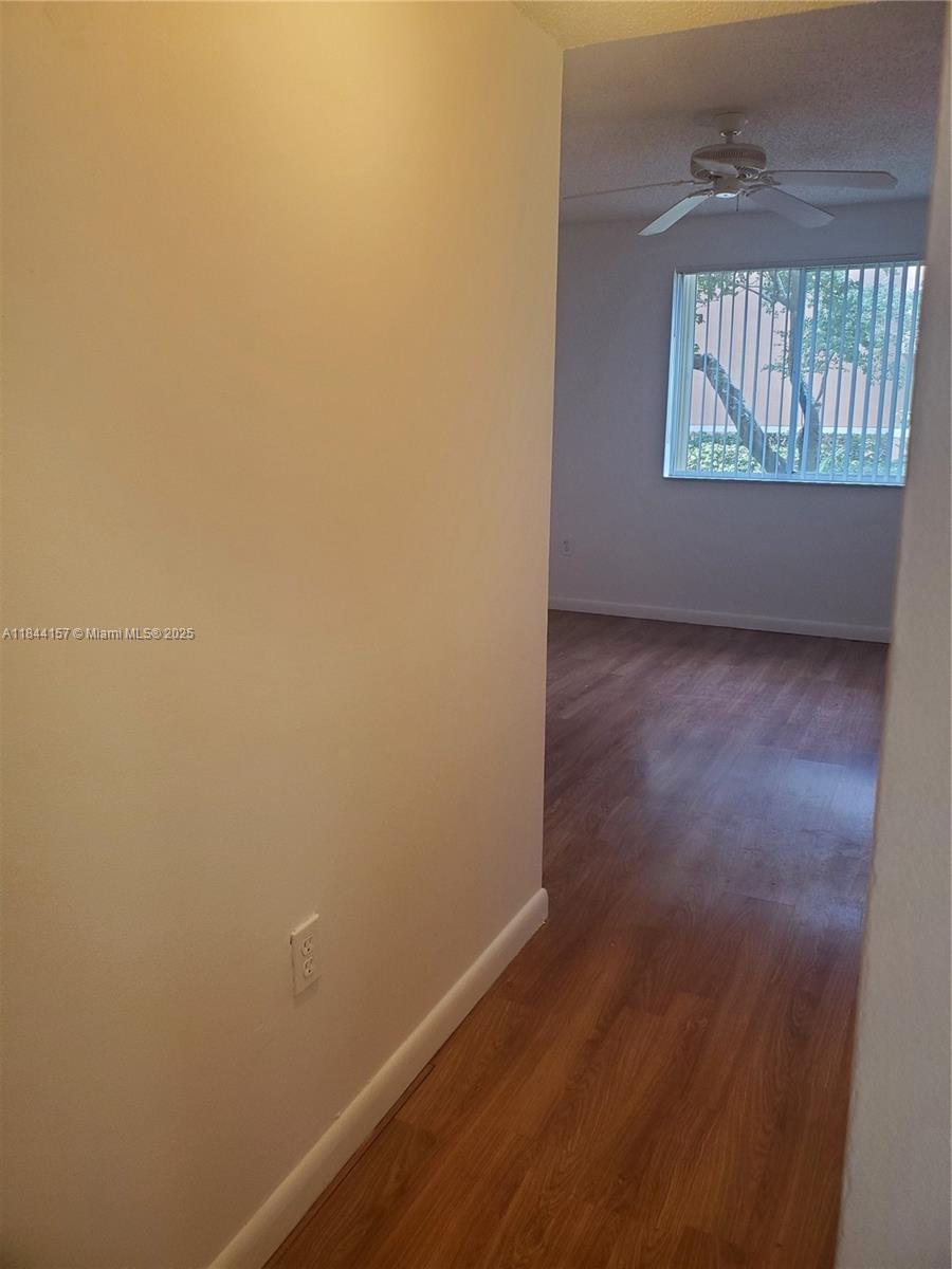 3874 Lyons Road, Unit 1126 Coconut Creek, FL 33073 - Photo 13 of 22 an empty room with windows
