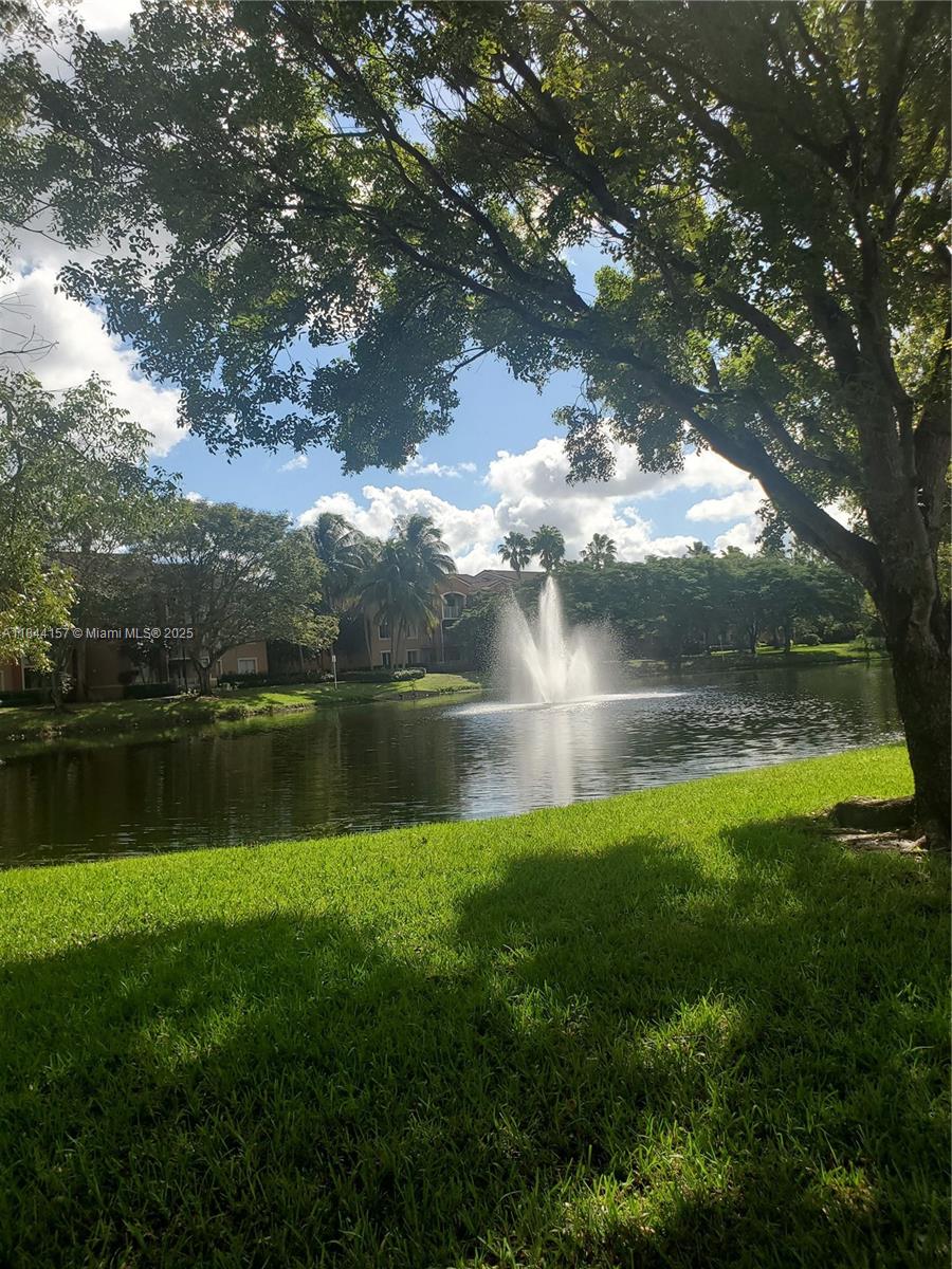 3874 Lyons Road, Unit 1126 Coconut Creek, FL 33073 - Photo 3 of 22 a view of a lake