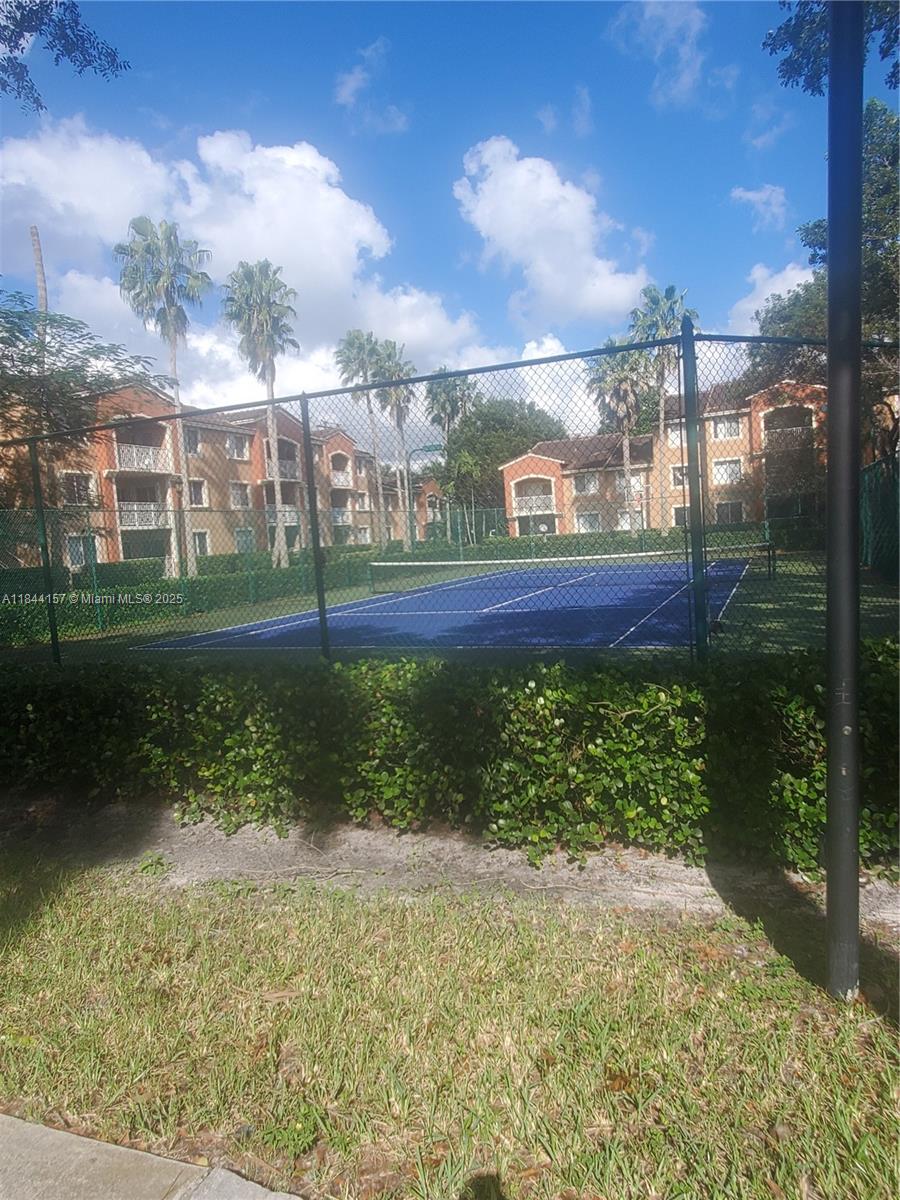 3874 Lyons Road, Unit 1126 Coconut Creek, FL 33073 - Photo 5 of 22 a yard with lake view and a lake view