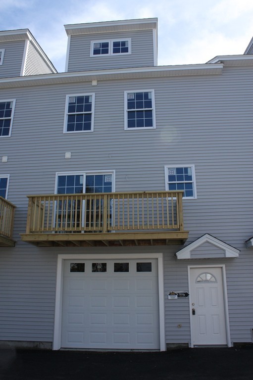 7 Butler Avenue, Unit B Lowell, MA 01852 - Photo 2 of 21 a view of a house with roof deck