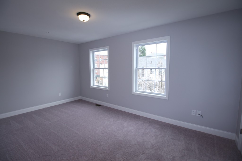 7 Butler Avenue, Unit B Lowell, MA 01852 - Photo 8 of 21 an empty room with a window