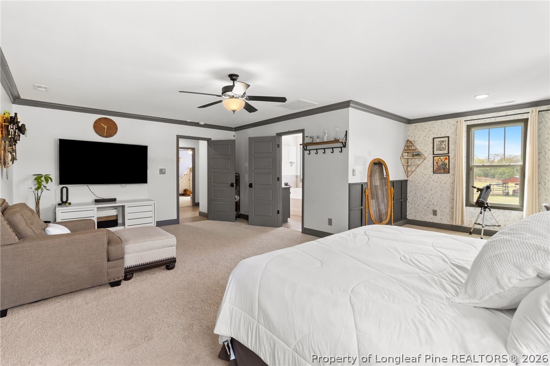 5535 Butler Nursery Road Fayetteville, NC 28306 - Photo 26 of 50 a spacious bedroom with a bed and a flat screen tv