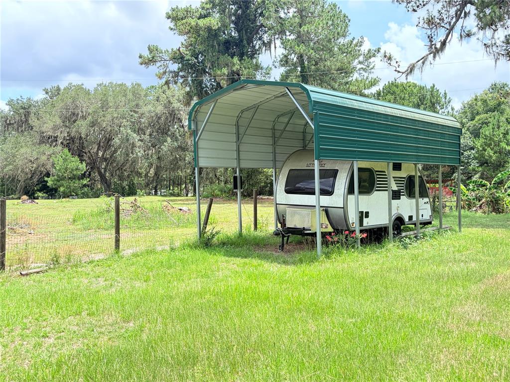 17900 Northwest 120th Avenue Road Reddick, FL 32686 - Photo 5 of 45 a view of a house with a backyard