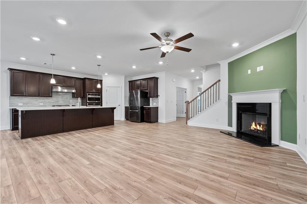 1204 Tahoe Place Canton, GA 30114 - Photo 16 of 73 a view of kitchen with a sink and a fireplace