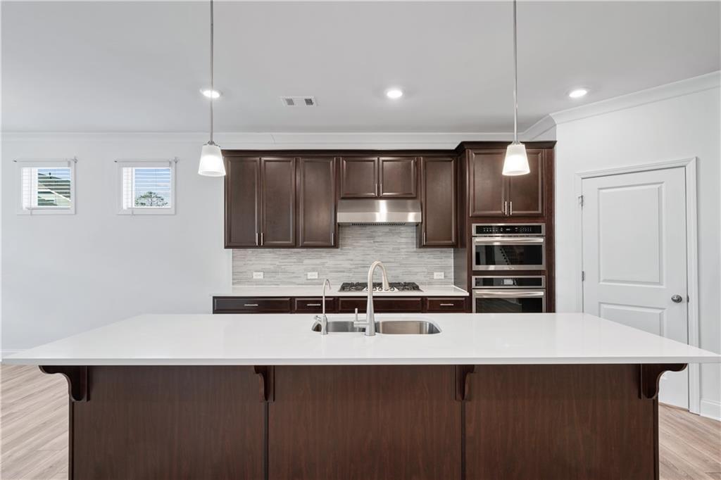 1204 Tahoe Place Canton, GA 30114 - Photo 18 of 73 a kitchen with stainless steel appliances a sink and a refrigerator