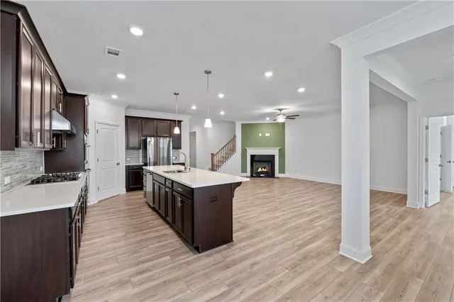 a view of a room with wooden floor and window