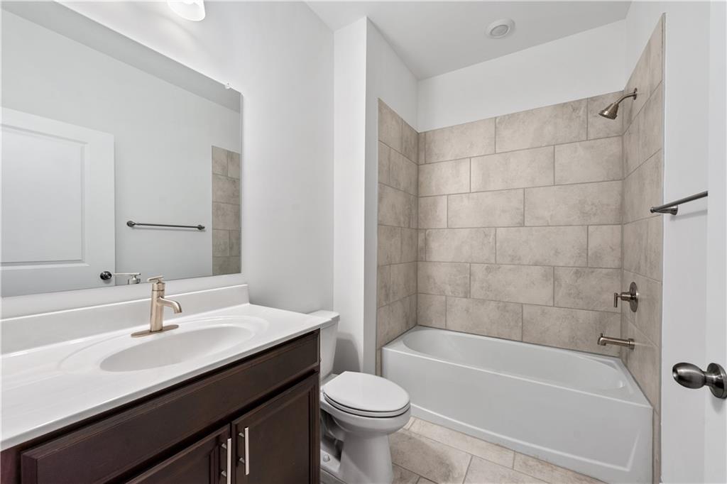 1204 Tahoe Place Canton, GA 30114 - Photo 24 of 73 a bathroom with a sink a toilet and a bathtub