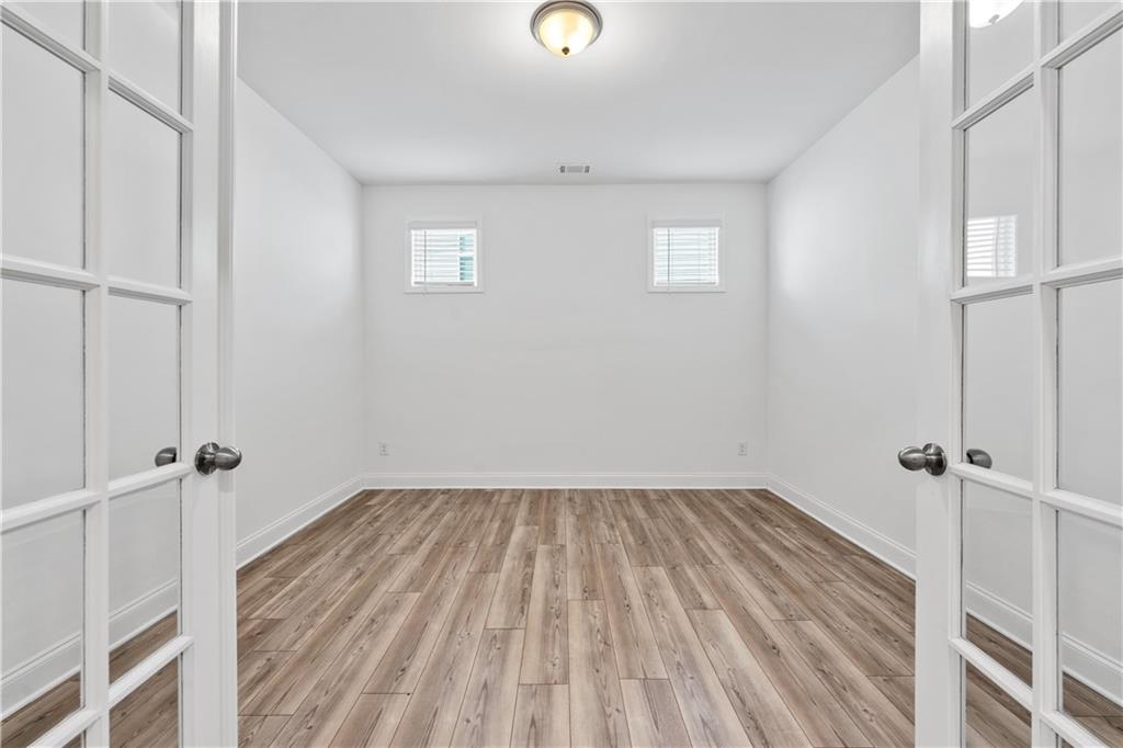 1204 Tahoe Place Canton, GA 30114 - Photo 27 of 73 a view of a room with wooden floor and window