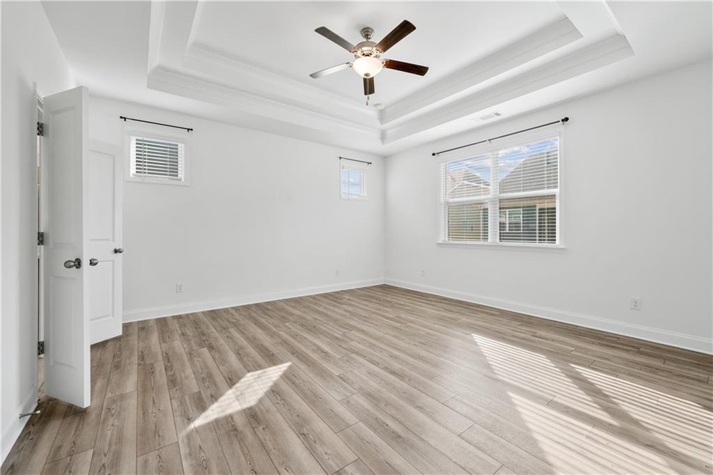 1204 Tahoe Place Canton, GA 30114 - Photo 29 of 73 a view of empty room with wooden floor and fan