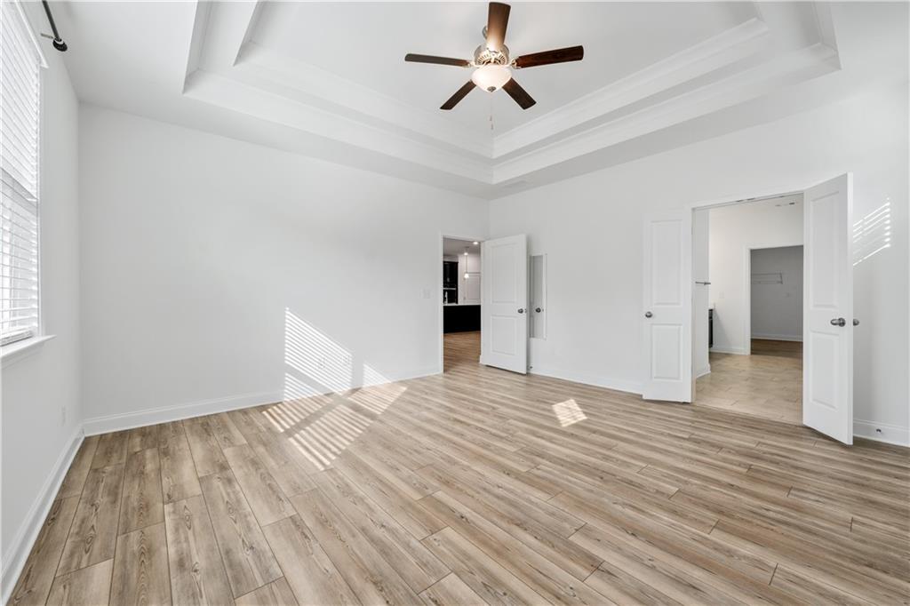 1204 Tahoe Place Canton, GA 30114 - Photo 30 of 73 a view of empty room with wooden floor and fan