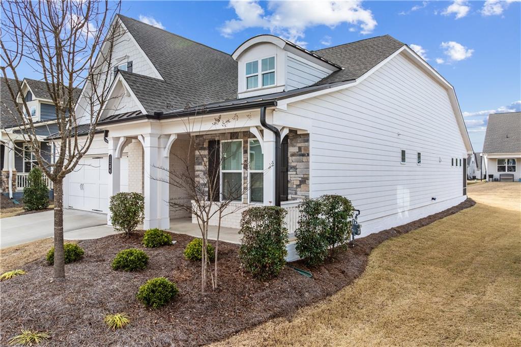 1204 Tahoe Place Canton, GA 30114 - Photo 3 of 73 a front view of a house with garden