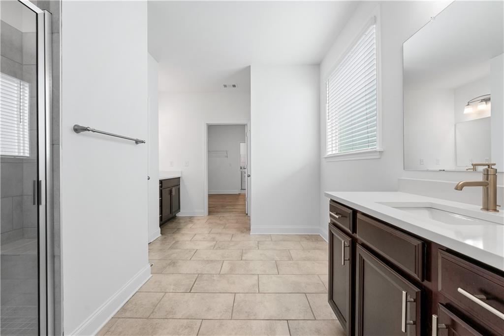 1204 Tahoe Place Canton, GA 30114 - Photo 31 of 73 a kitchen with a sink and a refrigerator