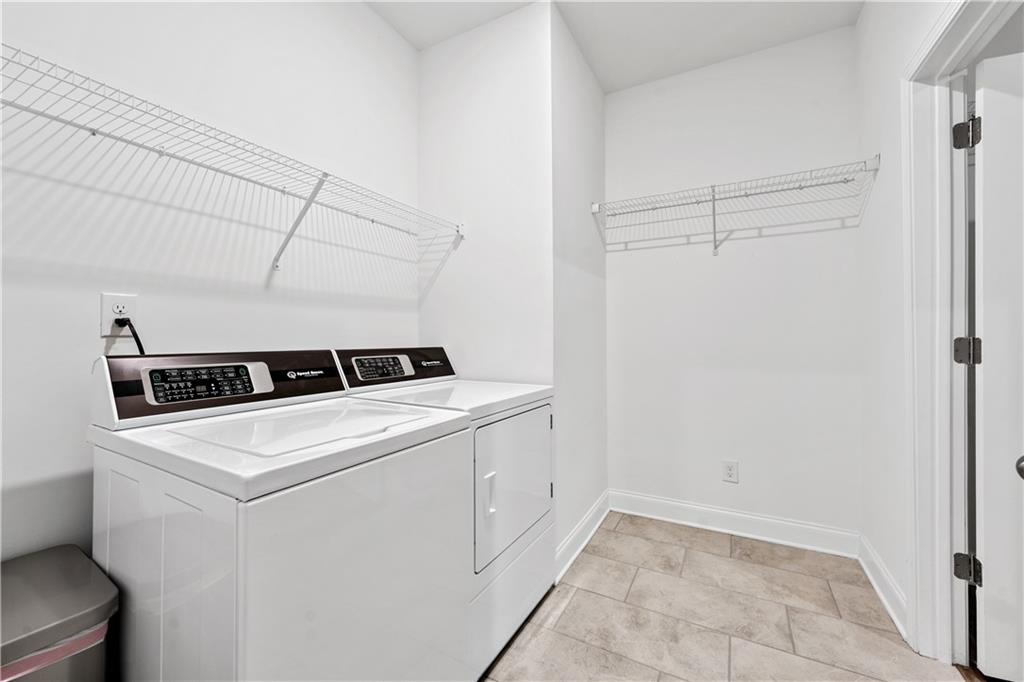 1204 Tahoe Place Canton, GA 30114 - Photo 36 of 73 a utility room with dryer and washer