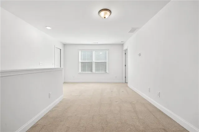 a living room with lots of furniture and a flat screen tv