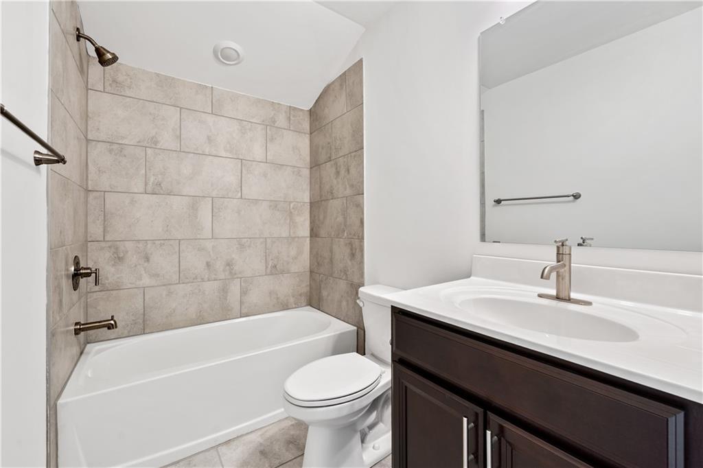 1204 Tahoe Place Canton, GA 30114 - Photo 40 of 73 a bathroom with a sink a toilet and bathtub