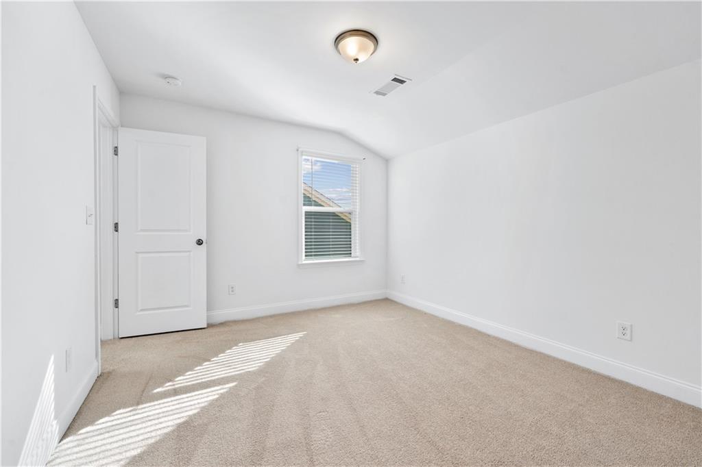 1204 Tahoe Place Canton, GA 30114 - Photo 41 of 73 an empty room with windows