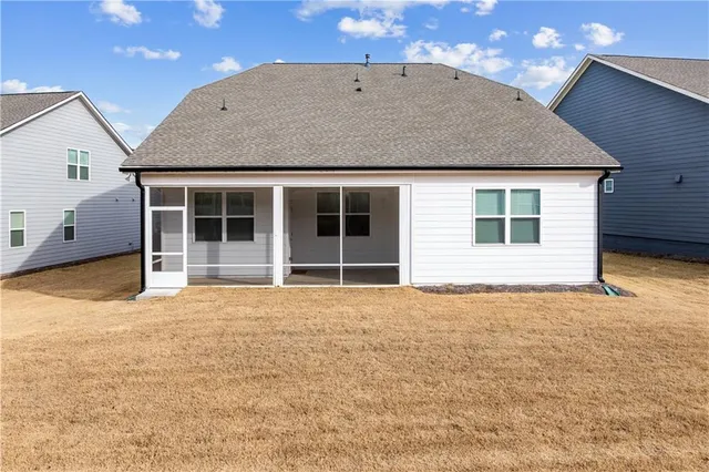 a kitchen with stainless steel appliances granite countertop a refrigerator a sink dishwasher a stove with wooden floors and cabinets