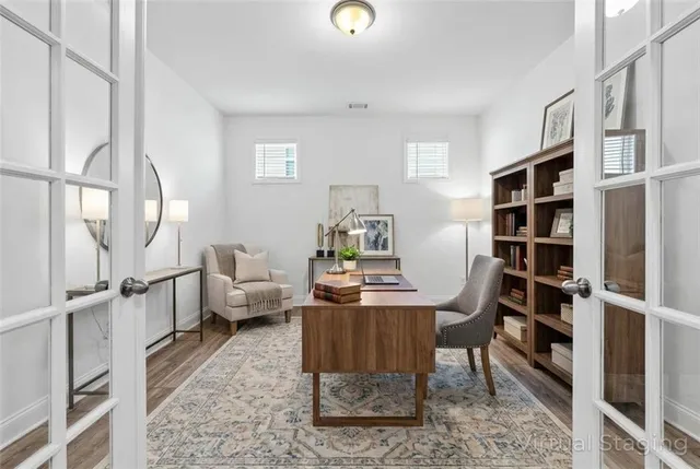 a view of a dining room with furniture window and wooden floor