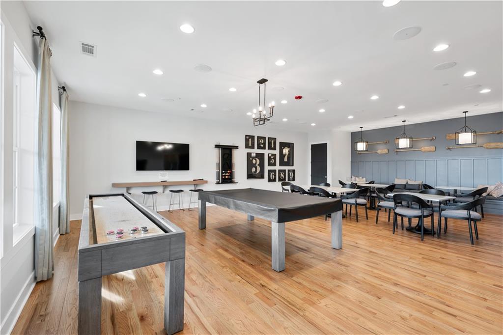 1204 Tahoe Place Canton, GA 30114 - Photo 56 of 73 a living room with lots of furniture and a flat screen tv