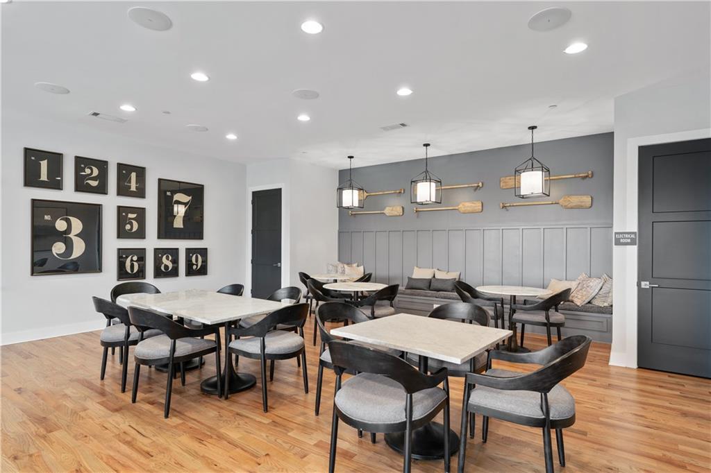1204 Tahoe Place Canton, GA 30114 - Photo 57 of 73 a view of a dining room with furniture and wooden floor