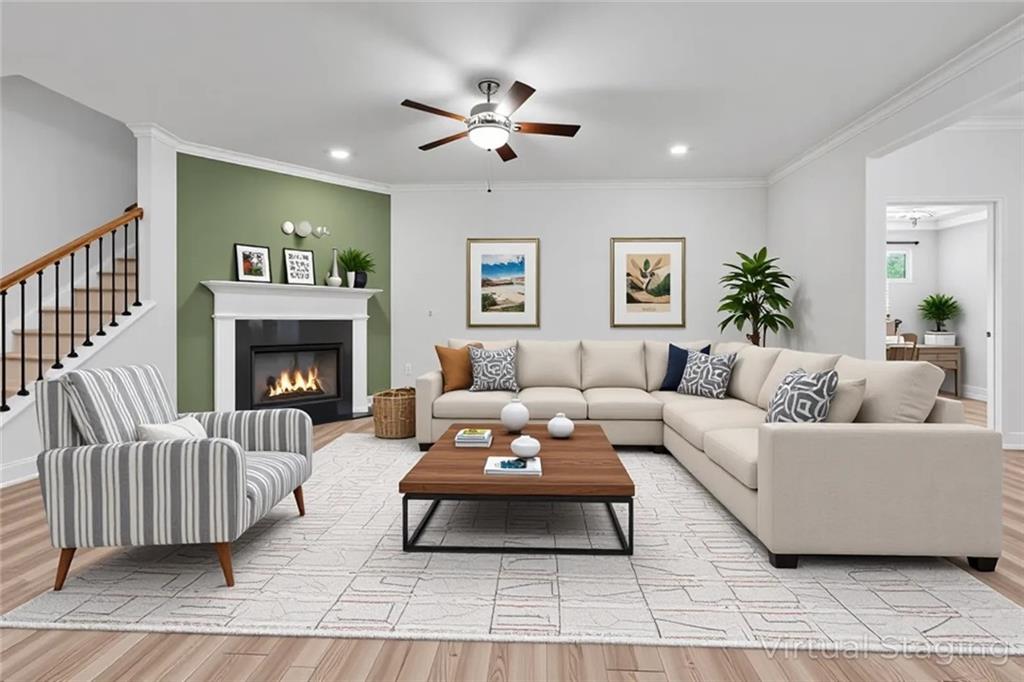 1204 Tahoe Place Canton, GA 30114 - Photo 6 of 73 a living room with furniture and a fireplace