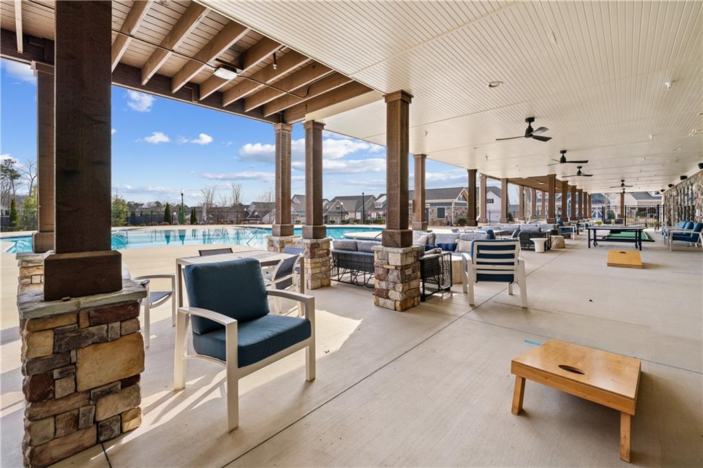 1204 Tahoe Place Canton, GA 30114 - Photo 67 of 73 a living room with patio furniture and a view of city